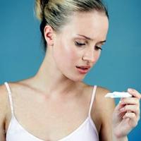 Woman and pregnancy test